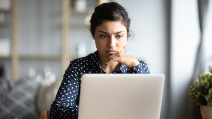 woman looking at a laptop
