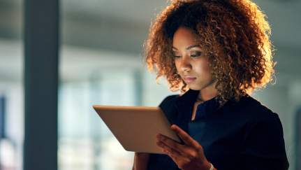 woman looking at a tablet